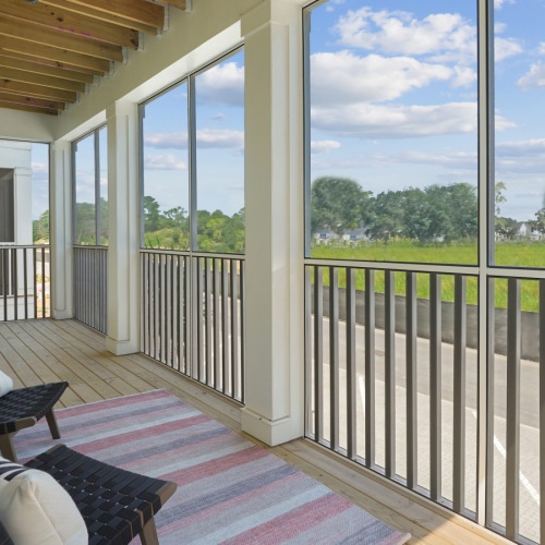 Delve into the visual splendor of Waterside at Pepper Hall Spacious private balcony with screen over looking greenery in Bluffton, SC